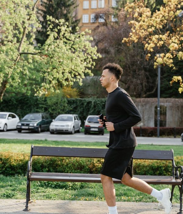 Person doing morning cardio exercises in a park